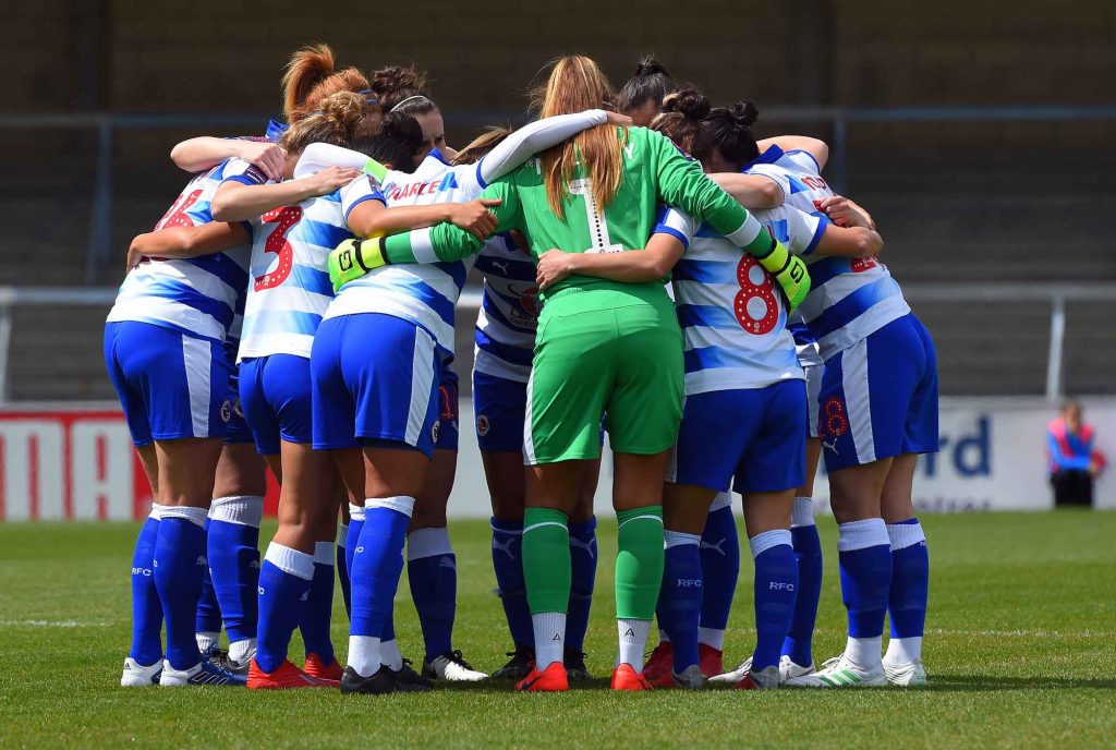 Reading FC Women in huddle on pitch