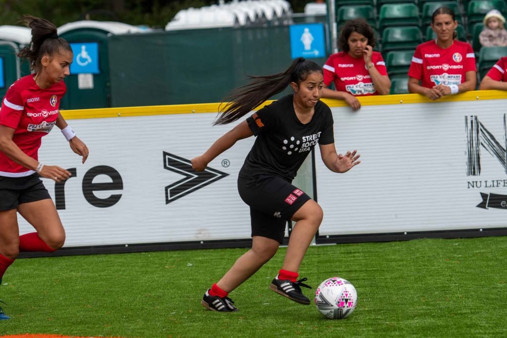 Street Soccer USA player dribbling the ball at Homeless World Cup