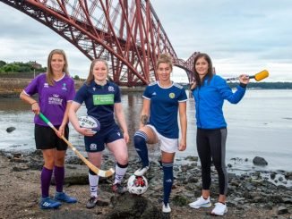 Scottish sportswomen at Forth bridge.