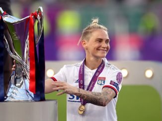 Lyon's Jess Fishlock with UWCL trophy in 2019