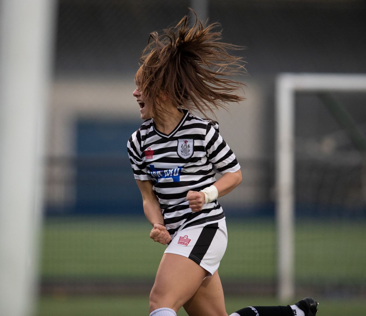 Abbi McDonald celebrates her equaliser for Queens Park