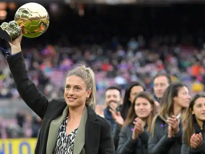 Alexia Putellas holds up the women's Ballon d'Or award, that she received during the 2021 Ballon d'Or