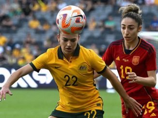 Australia's Charlotte Grant (L) fights for the ball with Spain's Olga Carmona