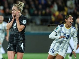 Philippines' midfielder #20 Quinley Quezada (R) and New Zealand's defender #04 Catherine Bott (L) react after Philippines' forward #07 Sarina Bolden (unseen) scored her team's first goal