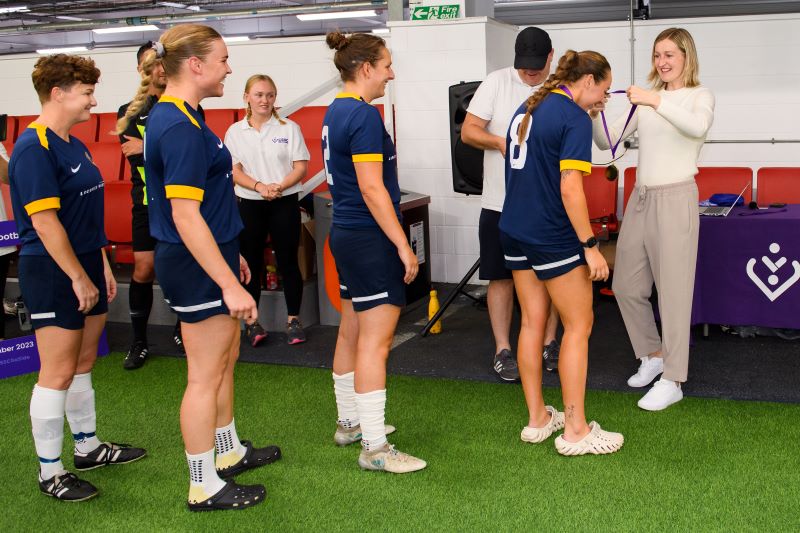 Lioness Ellen White with tournament winners from the Royal Navy