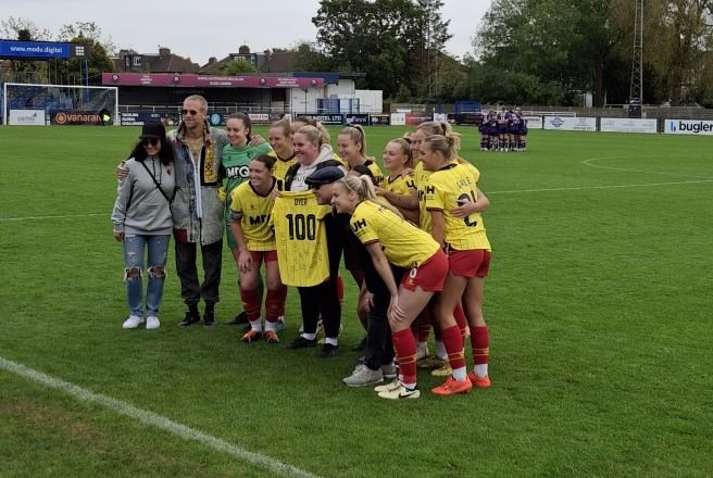 Watford's Assistant Coach Laura Dyer with a shirt to commemorate her 100th game with the club.