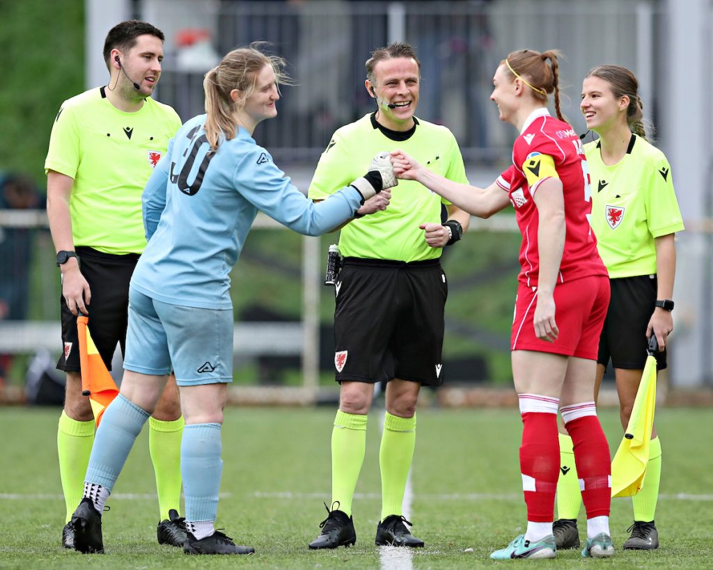 Amy Jenkins shakes hands at the start of the game