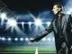 Head coach directing team strategy from sidelines during intense professional football match