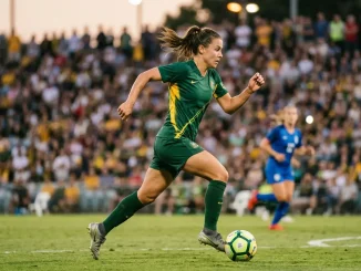 Australian Matildas footballer in action during international match in green and gold kit