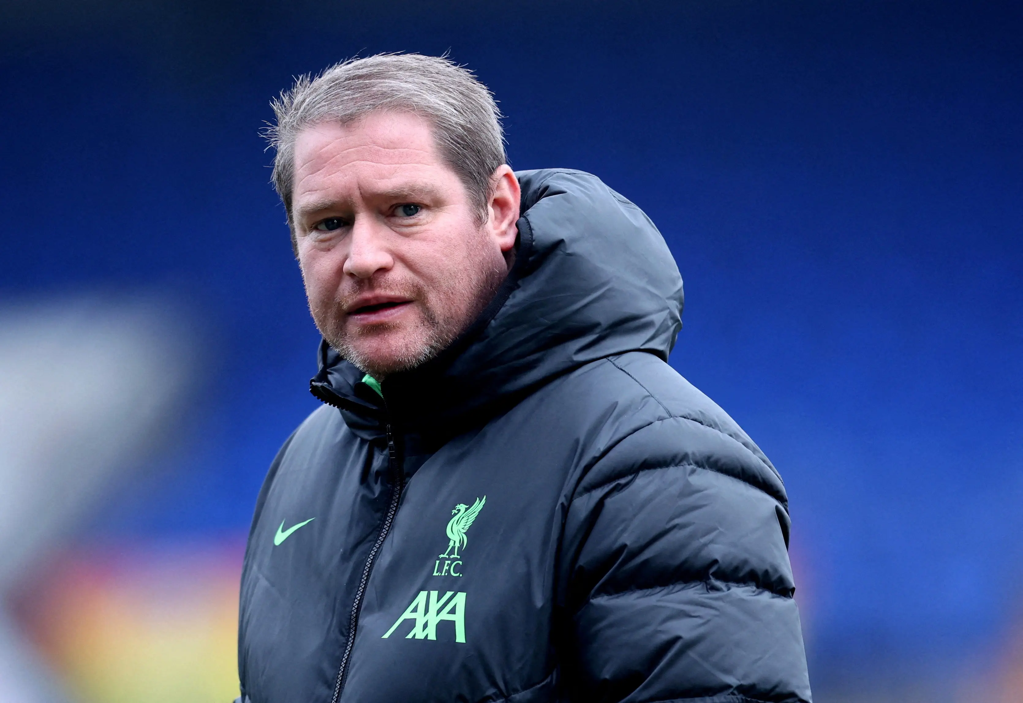 Matt Beard, manager of Liverpool Women, wearing a dark jacket during a match.