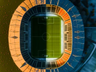 Empty soccer stadium split between autumn warmth and winter cold representing NWSL calendar debate