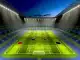 Empty football stadium at twilight with illuminated pitch representing Women's Champions League semi-finals