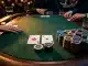 Luxury poker table with stacked chips and cards under dramatic lighting