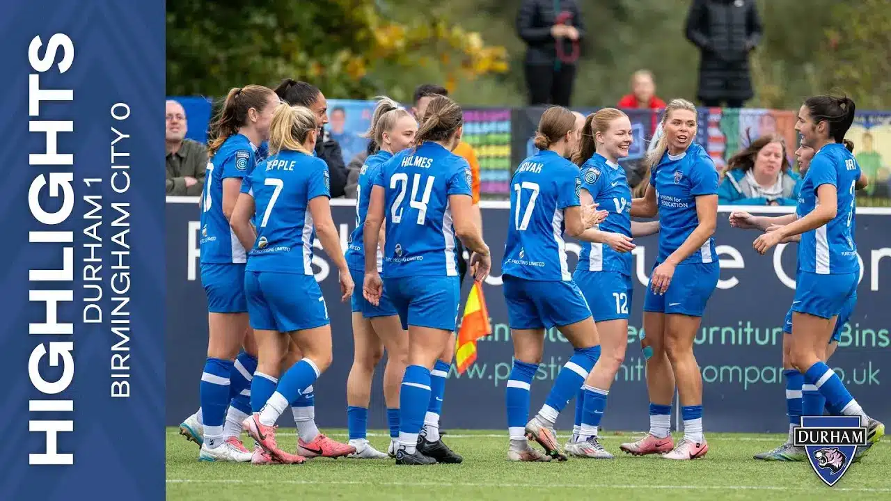 Durham Women FC team celebrating during a match against Birmingham City.