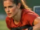 Female footballer during training with performance monitoring equipment, representing health science in women's football