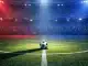 Floodlit football pitch with Haiti's blue and red colour scheme, ball on centre spot, dramatic stadium lighting.