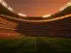 Floodlit stadium at dusk with packed stands and geometric shadow patterns, Belgian and New Zealand flag colors in lighting.