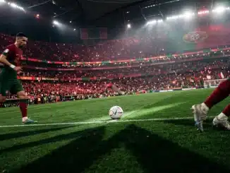 Floodlit stadium pitch at dusk with football on centre spot, crimson and emerald lighting, dramatic shadows.