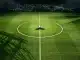 Floodlit stadium pitch with Saudi Arabia colours, football on centre spot, geometric shadows, empty stands.
