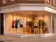 Modern women's football retail store with bright storefront on Manchester city street