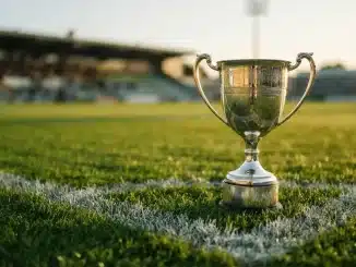 Silver trophy cup on football pitch with dramatic lighting representing WSL Subway Players Cup competition