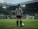 Female footballer in Newcastle-inspired kit prepares for a promotion push under stadium floodlights