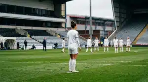 Women’s football defender preparing on the pitch for Leeds United’s promotion campaign