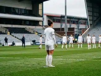 Women’s football defender preparing on the pitch for Leeds United’s promotion campaign