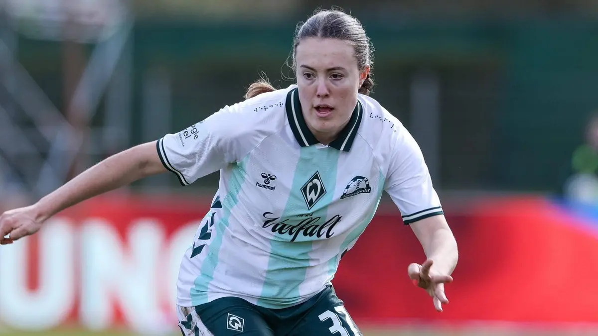 Mara Alber in a VfL Wolfsburg women's football team jersey during a match.
