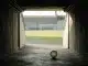 Empty stadium tunnel and football symbolise uncertainty around Poland's Under-20 Women's World Cup.