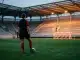 Women’s football midfielder training alone under stadium lights in a fresh start with Eintracht Frankfurt