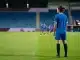 Japanese midfielder in blue training kit on a women’s football pitch inside a stadium